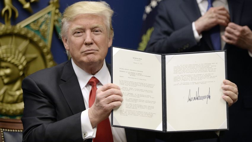 ARLINGTON, VA - JANUARY 27: U.S. President Donald Trump signs executive orders in the Hall of Heroes at the Department of Defense on January 27, 2017 in Arlington, Virginia. Trump signed two orders calling for the "great rebuilding" of the nation's military and the "extreme vetting" of visa seekers from terror-plagued countries. (Photo by Olivier Douliery-Pool/Getty Images)