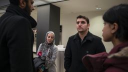 Said speaks with lawyers working pro-bono while waiting for his wife who has been detained on a J2 visa at the Dulles International Airport in Sterling, Virginia., on January 28, 2017. 