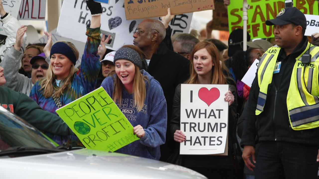 Protestors crowd the sidewalks at HartsfieldJackson Atlanta International Airport to denounce US President Donald Trump's executive order, which restricts refugees and travelers from seven Muslim-majority countries in Atlanta, Georgia on January 29, 2017
 / AFP / TAMI CHAPPELL        (Photo credit should read TAMI CHAPPELL/AFP/Getty Images)