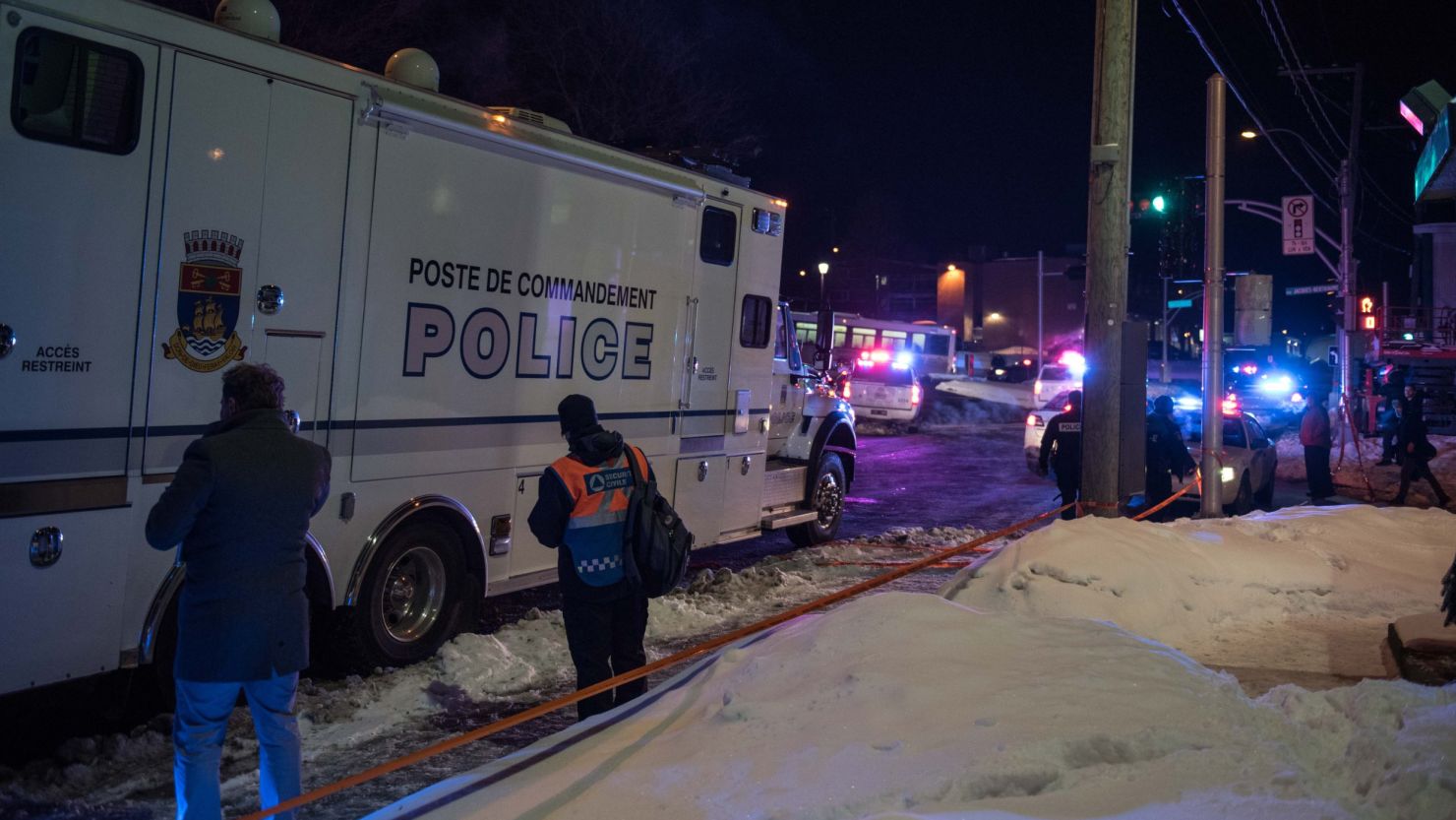 Canadian police officers respond to a shooting in a mosque at the Québec City Islamic cultural center on Sainte-Foy Street in Quebec city on January 29, 2017. 