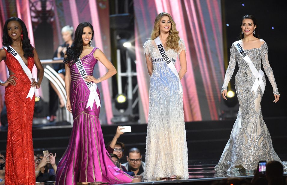 Miss Universe contestant Le Hang (R) of Vietnam in her long gown along with other candidates during the preliminary competition of the Miss Universe pageant.