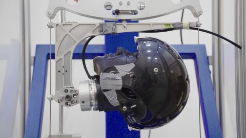 Testers drop different weights on the D3O helmets to find out how much force the material can absorb.
