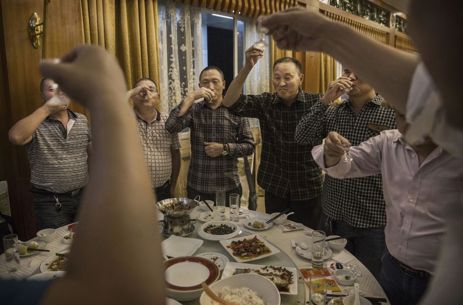 <strong>Moutai: </strong>Chinese men toast each other as they drink Moutai, the most famous brand of baijiu. Distilled from sorghum and rice, the spirit is the tipple of choice for everything from wedding receptions to business banquets.  