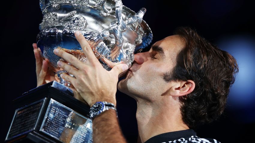 Roger Federer of Switzerland kisses the Norman Brookes Challenge Cup after winning the men's final match against Rafael Nadal