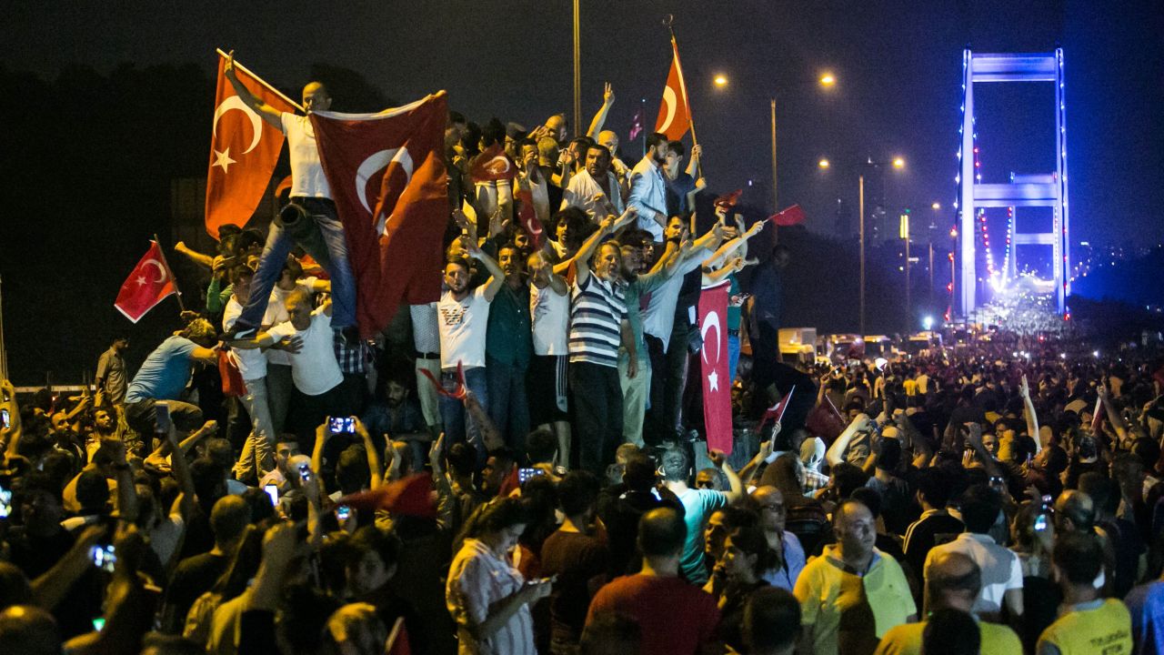 Turks take to the streets near the Fatih Sultan Mehmet bridge, which crosses the Bosphorus, in the early morning hours after a July, 15, 2016 coup attempt.