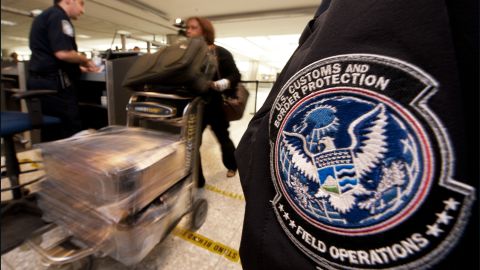 An air traveler is cleared by a Customs and Border Protection Officer at Dulles International Airport outside Washington.