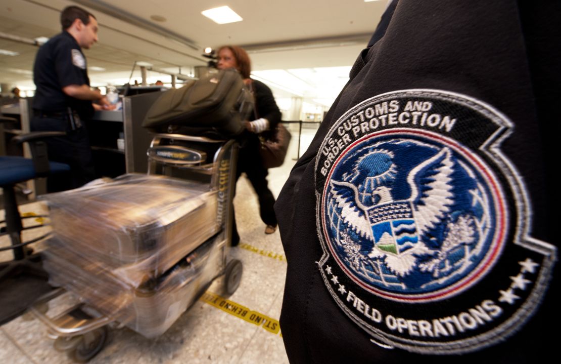 An air traveler is cleared by a Customs and Border Protection Officer at Dulles International Airport outside Washington.