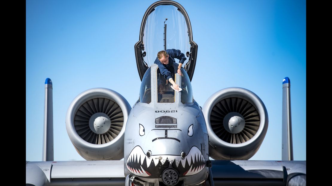 Senior Airman Felicia Anderson, 74th Aircraft Maintenance Unit crew chief, cleans cockpit glass on an A-10C Thunderbolt II on January 25 at Nellis Air Force Base, Nevada.