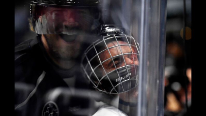 Pop star Justin Bieber is smashed into the glass by former hockey star Chris Pronger during a celebrity game in Los Angeles on Saturday, January 28. The game was part of the NHL's all-star festivities.