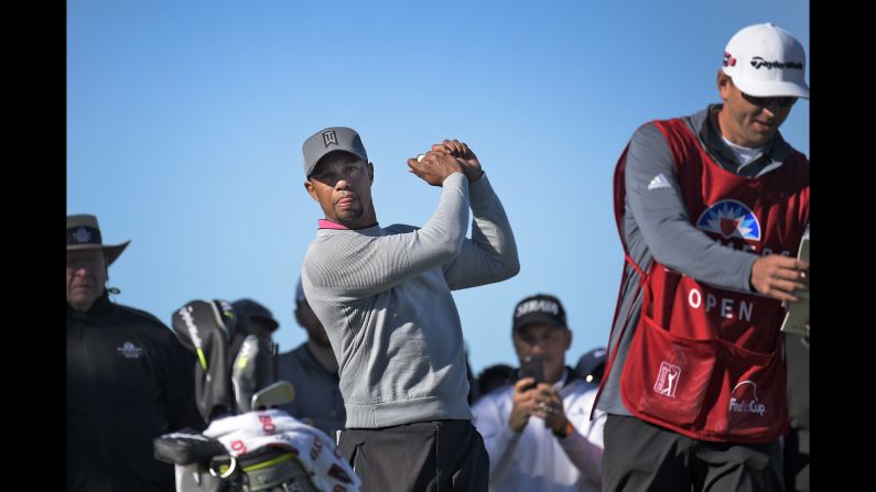 Tiger Woods takes a practice swing during the second round of the Farmers Insurance Open on Friday, January 27. Woods <a href="index.php?page=&url=http%3A%2F%2Fwww.cnn.com%2F2017%2F01%2F27%2Fsport%2Ftiger-woods-torrey-pines-pga-tour-comeback-2017%2F" target="_blank">missed the cut</a> as he works his way back from a long injury layoff.
