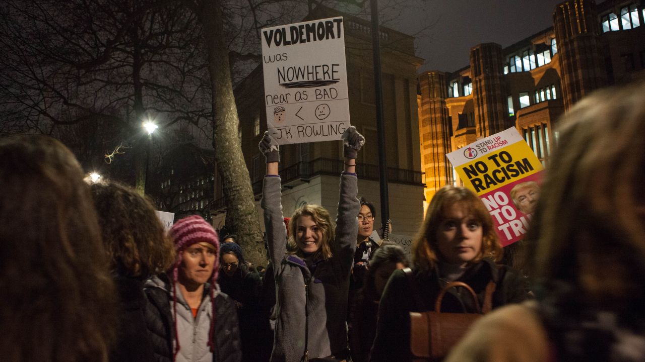 A Harry Potter fan holds a sign that reads, "Voldemort was nowhere near as bad," during the demonstration.