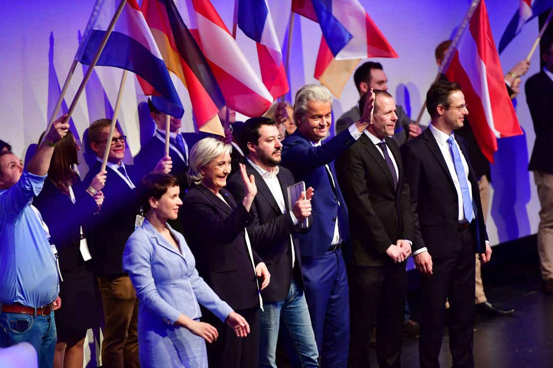 Le Pen stands on stage with other far-right European politicians at an event hosted by the Europe of Nations and Freedom political group.