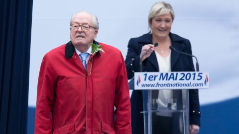 National Front founder Jean-Marie Le Pen stands in front of his daughter Marine Le Pen, president of the party.