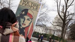 we the people muslim america woman protest sign