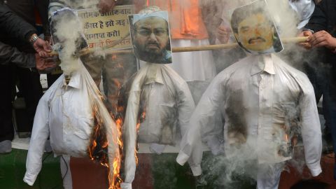 Activists burn an effigy of Hafiz Saeed during a protest in New Delhi on December 21, 2014.  