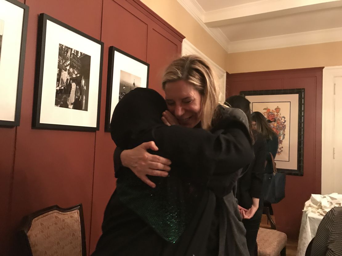 Maryam and Doreen embrace at the end of the Syria Supper Club dinner.