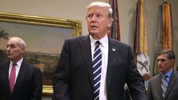 WASHINGTON, DC - JANUARY 31: U.S. President Donald Trump (C) arrives for a meeting with Homeland Security Secretary John Kelly (2nd L), National Security Advisor Michael Flynn, White House Government Initiatives Director Reed Cordish and other government cyber security experts in the Roosevelt Room at the White House January 31, 2017 in Washington, DC. Citing the hack of computers at the Democratic National Committee by Russia, Trump said that the private and public sectors must do more to prevent and protect against cyber attacks. (Photo by Chip Somodevilla/Getty Images)