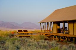 Namibia has stunning scenery such as this private reserve where visitors can see giraffes and other animals. 