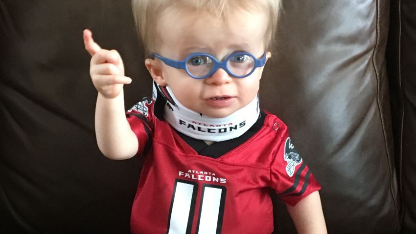 Wyatt Keeton captured hearts after an Atlanta hospital shared this photo on Facebook. The 17-month-old boy with dwarfism was instantly dubbed the Falcons cutest fan.