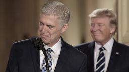 Judge Neil Gorsuch (L) speaks, after US President Donald Trump nominated him for the Supreme Court, at the White House in Washington, DC, on January 31, 2017. nominee, tilting the balance of the court back in the conservatives' favor. / AFP / Brendan SMIALOWSKI 