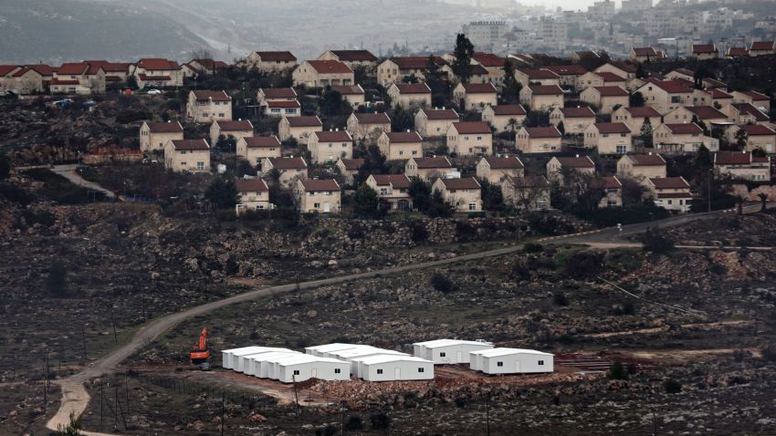New prefabricated homes are seen under construction in the West Bank between the Israeli outpost of Amona and the Israeli settlement of Ofra (background), north of Ramallah, on January 31, 2017.
Israel's parliament has postponed a vote that would allow it to appropriate hundreds of hectares of Palestinian land in the occupied West Bank, the parliament's website said. / AFP / THOMAS COEX (Photo credit should read THOMAS COEX/AFP/Getty Images)