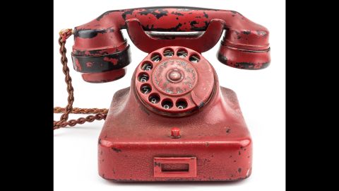 Hitler's phone, which was originally black, was painted red and engraved with his name and a swastika.