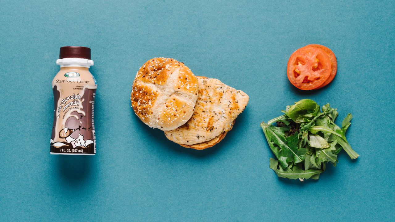 The grilled chicken sandwich is a satisfying option for athletes. It offers 38 grams of carbs to fuel muscles and 35 grams of protein to build and repair them, and it is relatively low in fat. Grab a kids' chocolate milk as a post-workout beverage. It offers a beneficial amount of carbs and protein for recovery.