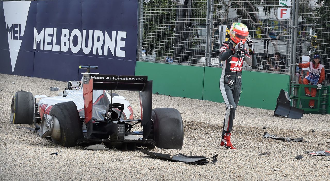 His first weekend with the team in Australia ends with a dramatic crash with Fernando Alonso's McLaren.