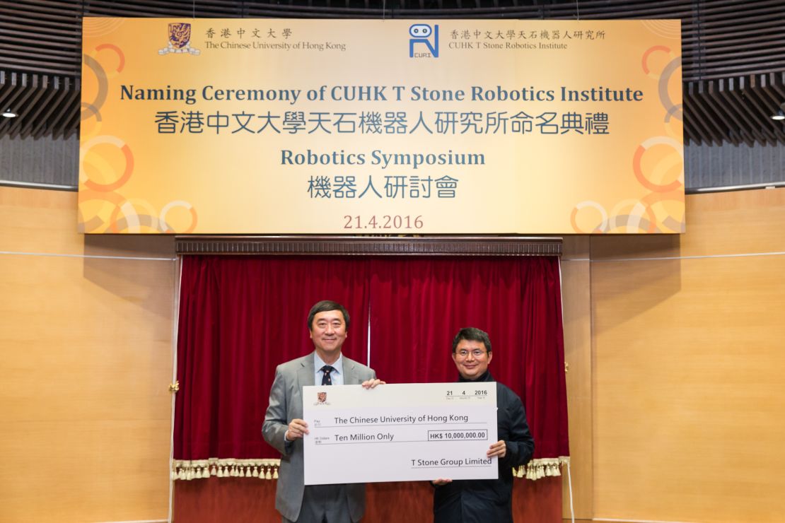 Xiao Jianhua (R) giving a donation check to Chinese University of Hong Kong President Professor Joseph Sung  in April 2016.