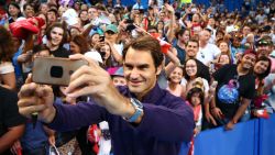 PERTH, AUSTRALIA - DECEMBER 29:  Roger Federer of Switzerland poses for a selfie with spectators after a practice session at the Perth Arena on December 29, 2016 in Perth, Australia.  (Photo by Paul Kane/Getty Images)