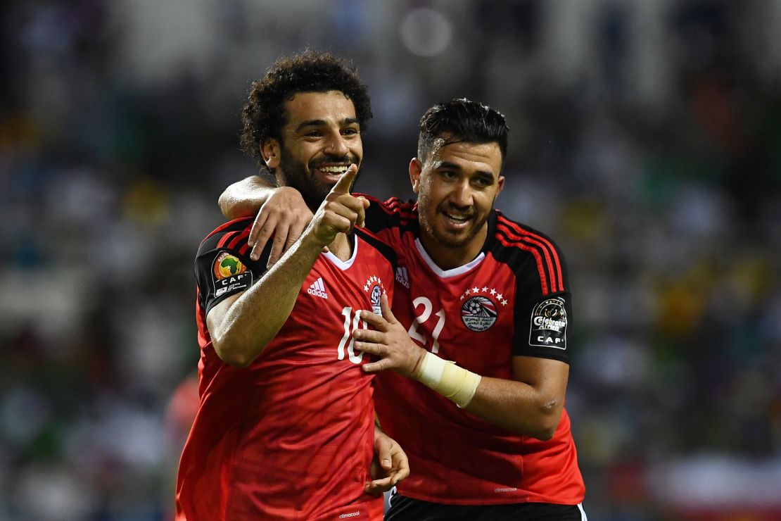 Salah (L) celebrates with Egypt's midfielder Mahmoud Hassan after scoring a goal during the 2017 Africa Cup of Nations.


 