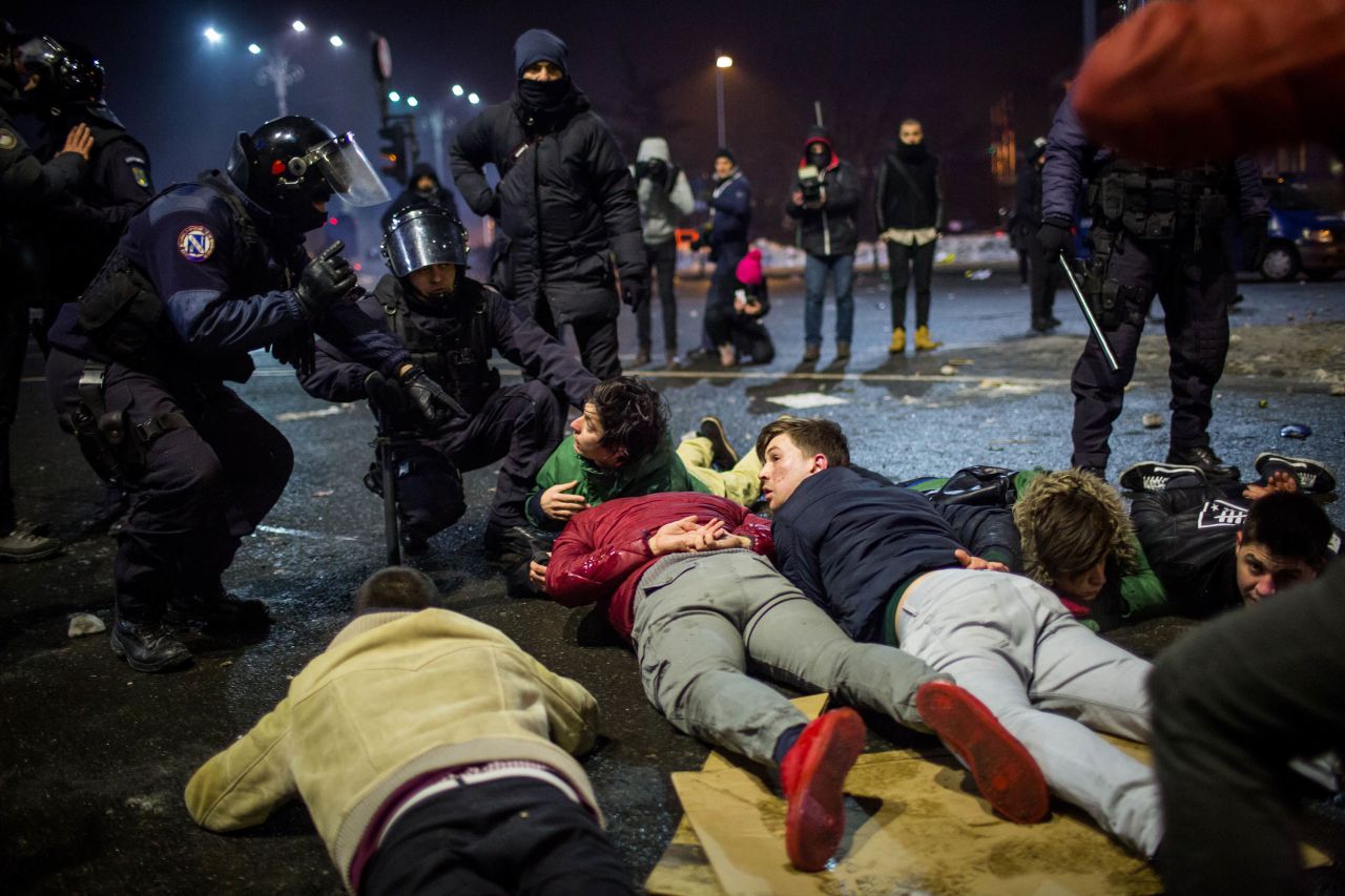 Police detain demonstrators February 1 in Bucharest.