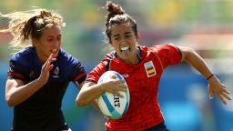 RIO DE JANEIRO, BRAZIL - AUGUST 06:  Patricia Garcia of Spain scores a try past Lina Guerin of France during a Women's Pool B rugby match between France and Spain on Day 1 of the Rio 2016 Olympic Games at Deodoro Stadium on August 6, 2016 in Rio de Janeiro, Brazil.  (Photo by Mark Kolbe/Getty Images)