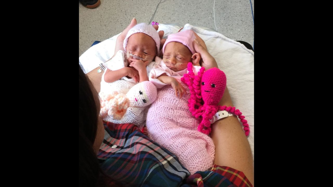 Mother Kat Smith holds her twins and their octopi at Poole Hospital.