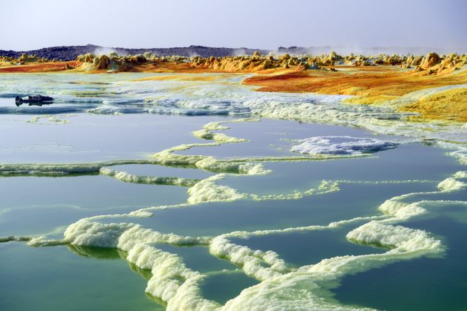  A sulphur lake in the Danakil Depression near Dallol, Ethiopia.<br /><br />The depression lies 100 meters below sea level and is one of the world's hottest and most inhospitable locations, with National Geographic calling it the "<a href="http://ngm.nationalgeographic.com/ngm/0510/feature2/" target="_blank" target="_blank">cruelest place on Earth</a>."  <br /><br />Despite temperatures that reach over 50 degrees centigrade, it remains a lively and important economic hub, where Ethiopians maintain a centuries-old industry of mining salt from the ground by hand.