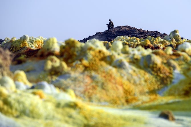 An Ethiopian soldier monitors the miners from a hilltop. 