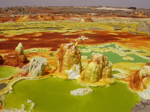 The depression is home to some of the most spectacular geological features in the world. The landscape is dotted with volcanoes, brightly-colored acid pools, molten rock and mighty salt pans. 
