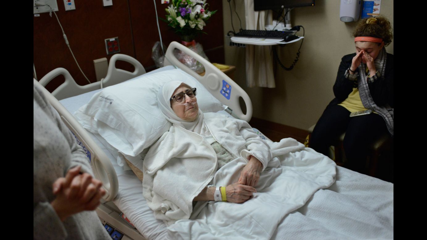 Isaaf Jamal Eddin lies in bed as her granddaughter, Judy Ulayyet, wipes away tears at a hospital in Munster, Indiana, on Saturday, January 28. The day before, US President Donald Trump signed an <a href="http://www.cnn.com/2017/01/28/politics/text-of-trump-executive-order-nation-ban-refugees/index.html" target="_blank">executive order banning nationals of seven Muslim-majority countries</a> -- Iraq, Syria, Iran, Libya, Somalia, Sudan and Yemen -- from traveling to the US for at least the next 90 days. The executive order bans entry from those fleeing war-torn Syria indefinitely and also suspends the admission of all refugees to the United States for four months. At far left is Nour Ulayyet, Judy's mother and daughter of Eddin. Nour said her sister -- a Syrian living in Saudi Arabia -- had a valid visa to travel to the US but after arriving on Saturday, she was told at the airport that she couldn't enter to help care for their sick mother. Trump has issued a statement defending the new executive order, saying: "We will continue to show compassion to those fleeing oppression, but we will do so while protecting our own citizens and voters."