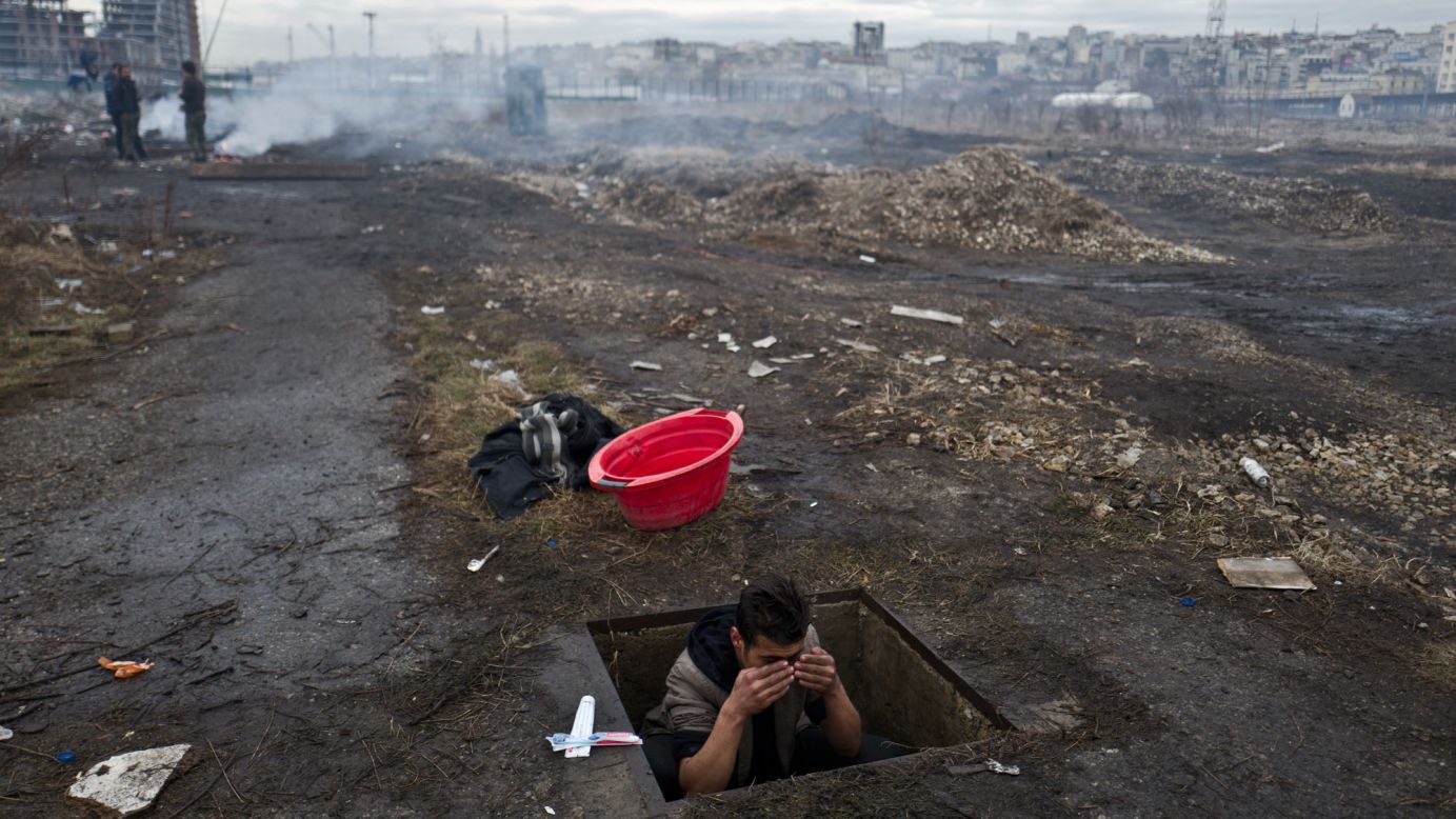 An Afghan refugee washes himself in a hole in the ground outside an old train carriage where he and other migrants took refuge in Belgrade, Serbia, on Thursday, February 2. For the past month, refugees and migrants have been <a href="http://www.cnn.com/2017/01/11/europe/refugees-belgrade-europe-cold-snap/index.html" target="_blank">trying to survive the freezing winter</a>, with many seeking shelter in crumbling buildings with broken windows, no heating or warm water.