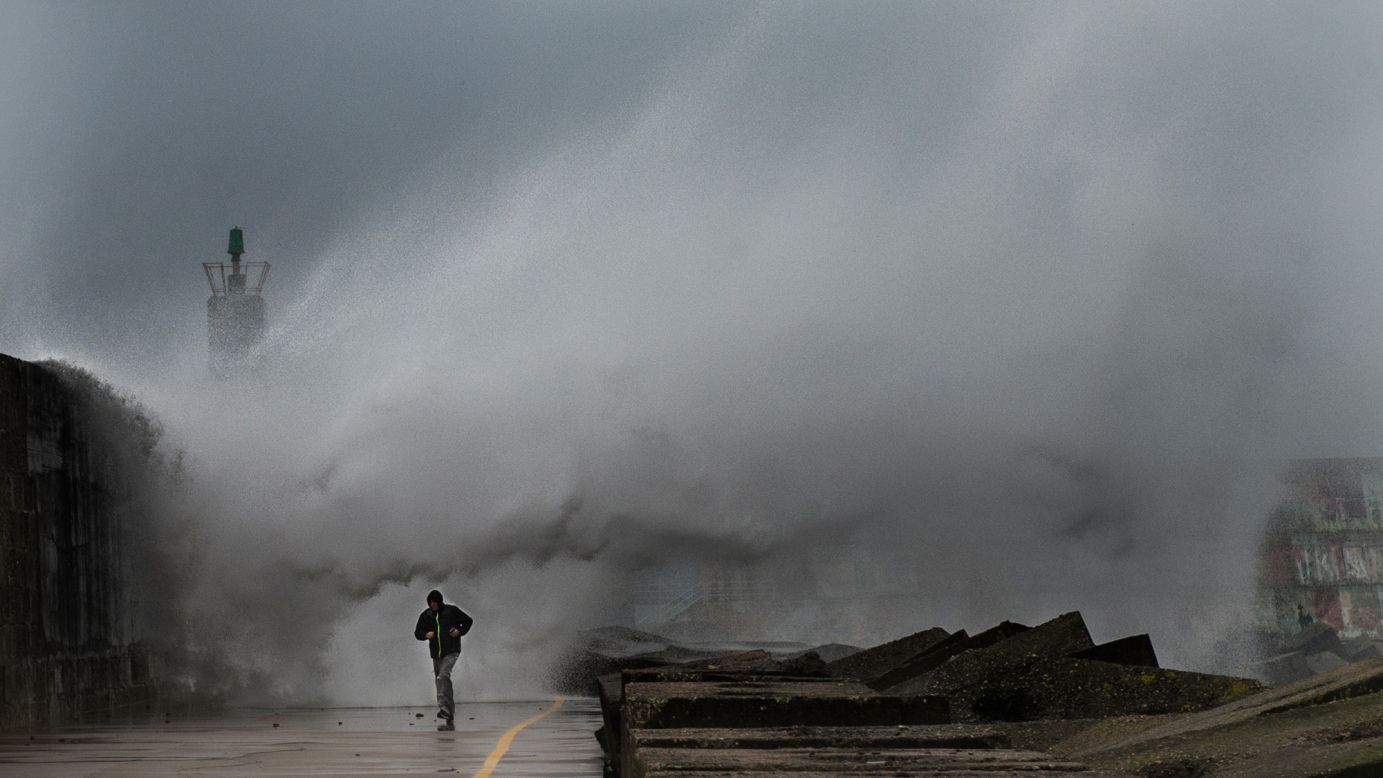 A large wave hits the pier of the A Guarda port in northwestern Spain during a storm on Thursday, February 2.