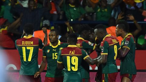 Cameroon's players celebrate after Michael Ngadeu-Ngadjui scored his side's opening goal.