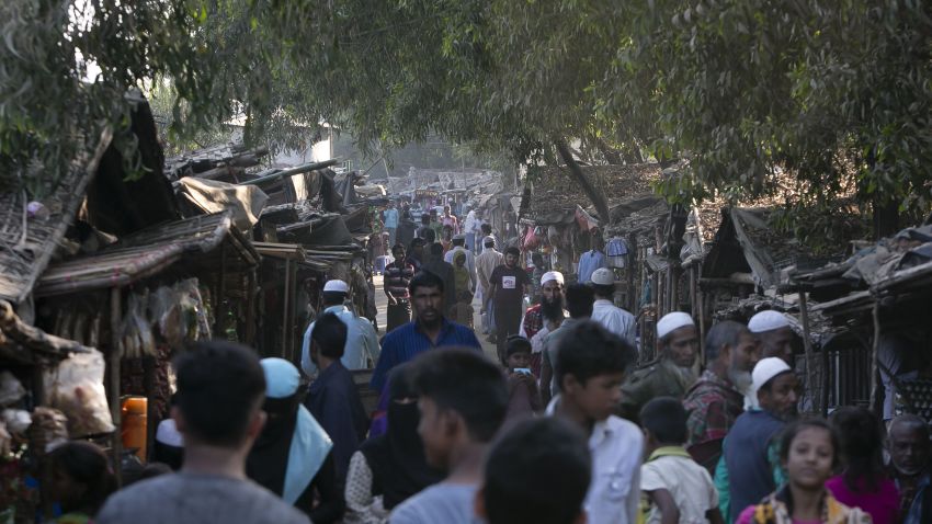 TEKNAF, BANGLADESH - JANUARY 18: Rohingyas walk through the Leda unregistered camp on January 18, 2017 in Teknaf, Bangladesh. More than 65,000 Rohingya Muslims have fled to Bangladesh from Myanmar since October last year, after the Burmese army launched a campaign it calls "clearance operations" in response to an attack on border police on October 9, believed to have been carried out by Rohingya militants. Waves of Rohingya civilians have since fled across the border, most living in makeshift camps and refugee centers with harrowing stories on the Burmese army committing human-rights abuses, such as gang rape, arson and extrajudicial killing. The Rohingya, a mostly stateless Muslim group numbering about 1.1 million, are the majority in Rakhine state and smaller communities in Bangladesh, Thailand and Malaysia. The stateless Muslim group are routinely described by human rights organizations as the "most oppressed people in the world" and a "minority that continues to face statelessness and persecution." (Photo by Allison Joyce/Getty Images)