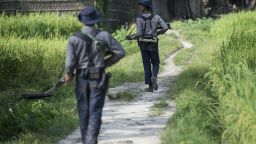 Armed police conduct search operations at Warpait village in Maungdaw, located in Rakhine State, on October 14, 2016 as the government announced that terror groups were behind the series of attacks.
