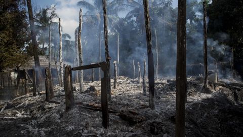 Smouldering debris of burned houses is seen in a village in Myanmar's Rakhine state.