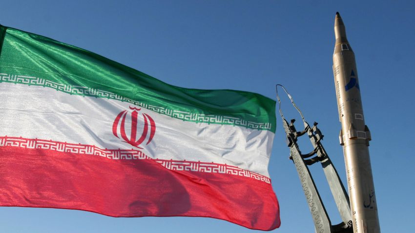 An Iranian flag flutters next to a ground-to-ground Sajil missile before being launched at an undisclosed location in Iran on November 12, 2008. Iran test fired today a new generation of ground-to-ground missile, the semi-official Fars news agency quoted the defence minister as saying. In the past Iran has often boasted of developing new weapons systems only to be met with scepticism from Western defence analysts. AFP PHOTO/FARS NEWS/STR (Photo credit should read -/AFP/Getty Images)