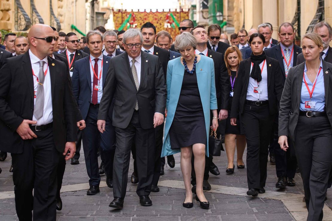 President of the European Union Jean-Claude Juncker and British Prime Minister Theresa May walk between photo calls at a summit in Malta in February.