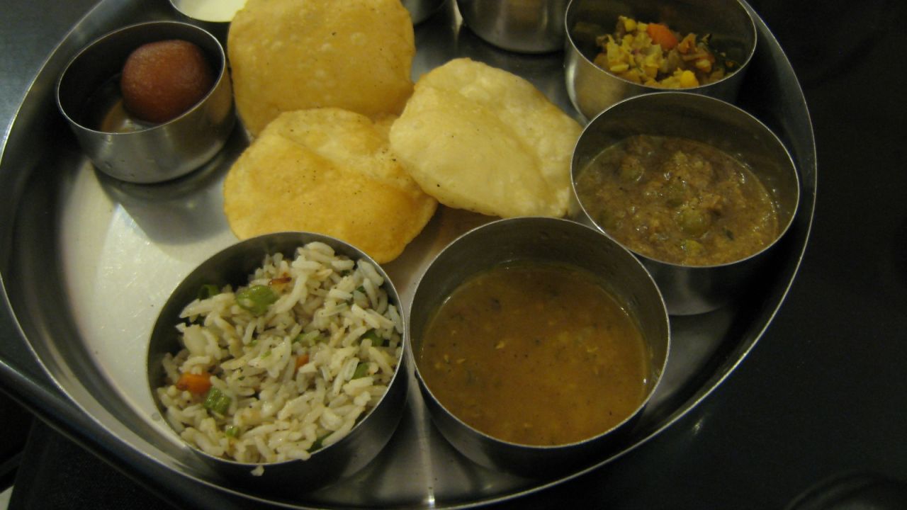 <strong>Western India:</strong> In the state of Gujarat, you'll likely encounter a Gujarati <em>thali </em>-- a platter of various dals, <em>kadhi</em> (a sour yogurt curry with vegetable fritters), <em>sabzi</em> (a mixed vegetarian dish), steamed basmati rice and <em>rotli </em>bread.