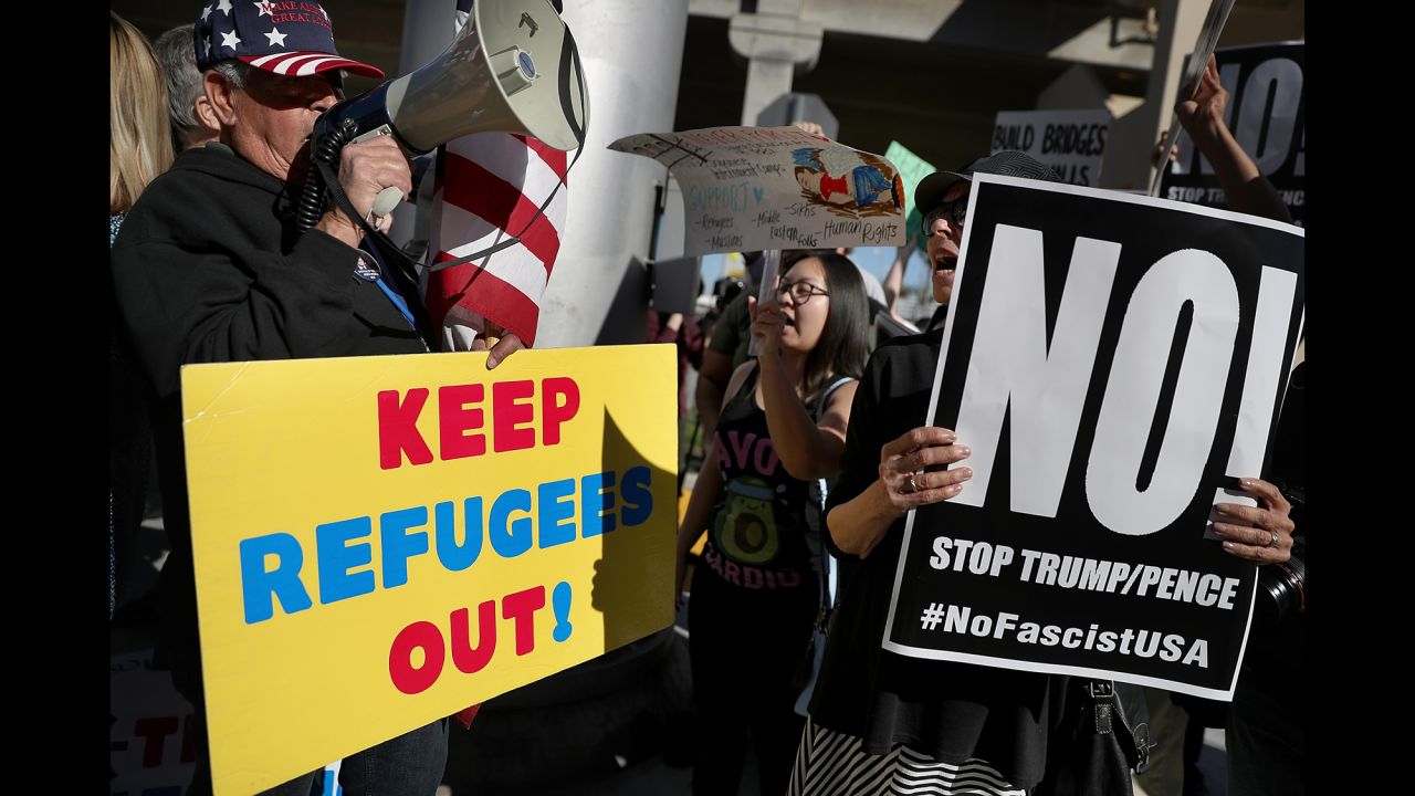 Protesters face off at Los Angeles International Airport on Sunday, January 29. America's major airports <a href="http://www.cnn.com/2017/01/29/politics/us-immigration-protests/" target="_blank">became ground zero for protests</a> after President Trump signed an executive order that temporarily suspended the admission of refugees and barred entry to the United States from seven Muslim-majority countries. The executive order was quickly decried as a "Muslim ban" by Democrats, human rights organizations and advocacy groups, who slammed Trump for instituting a policy they say cuts against US values and America's image around the world as a sanctuary for those fleeing oppression. Trump defended his order, saying, "this is not a Muslim ban, as the media is falsely reporting. This is not about religion -- this is about terror and keeping our country safe." He said the seven countries were "previously identified by the Obama administration as sources of terror," and he said visas would be issued again after secure policies are reviewed and implemented. 