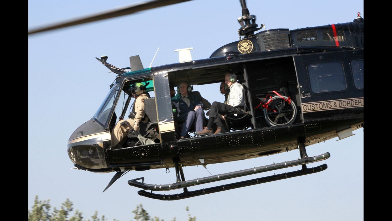 Homeland Security Secretary John Kelly, right, takes a helicopter tour of the Texas-Mexico border on Wednesday, February 1. He was joined by Texas Gov. Greg Abbott, center.