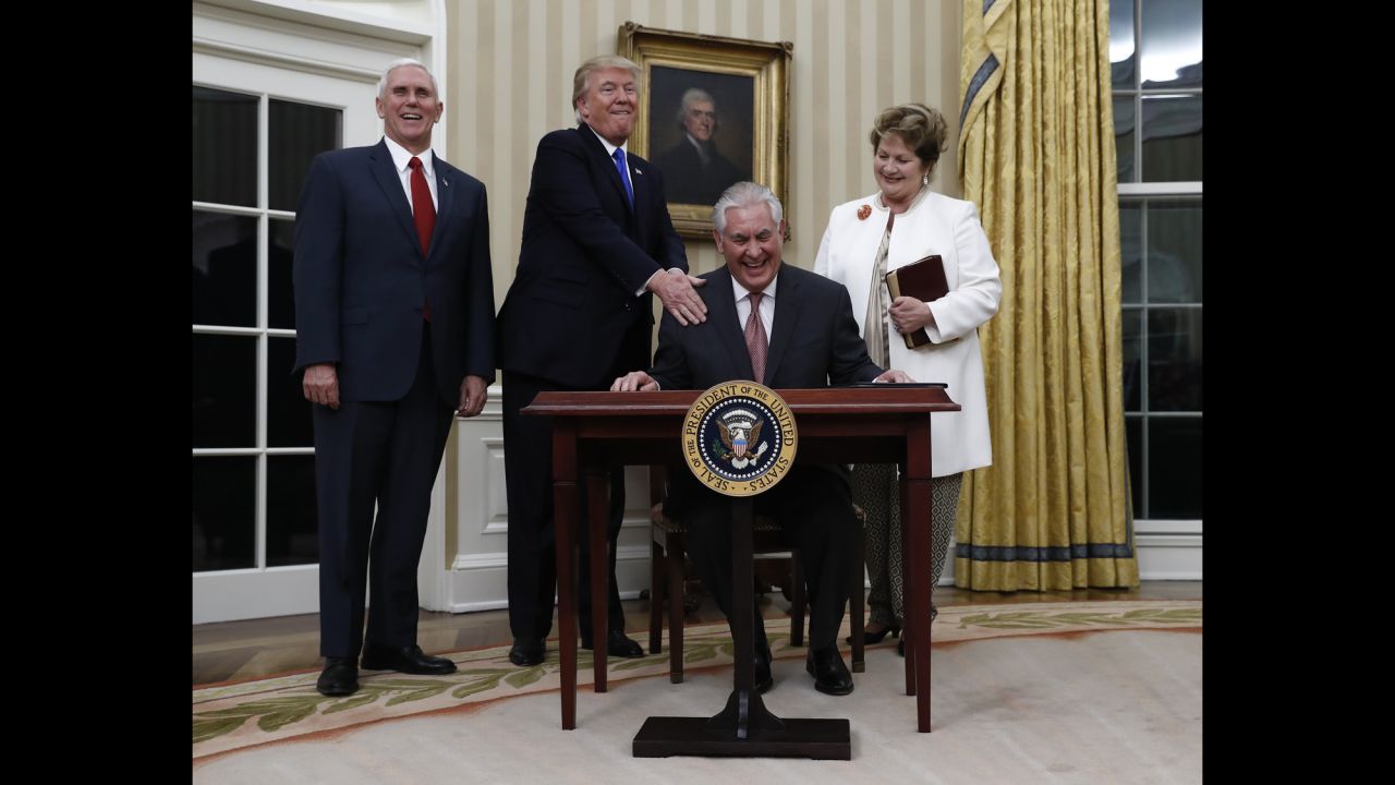 Trump puts his hand on the shoulder of Secretary of State Rex Tillerson after <a href="http://www.cnn.com/2017/02/01/politics/tillerson-confirmation-vote-senate/" target="_blank">Tillerson was sworn in</a> on Wednesday, February 1. They are joined by Vice President Mike Pence and Tillerson's wife, Renda St. Clair.